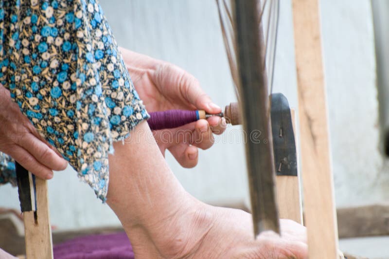 Working a spinning wheel stock photo. Image of material - 23795626