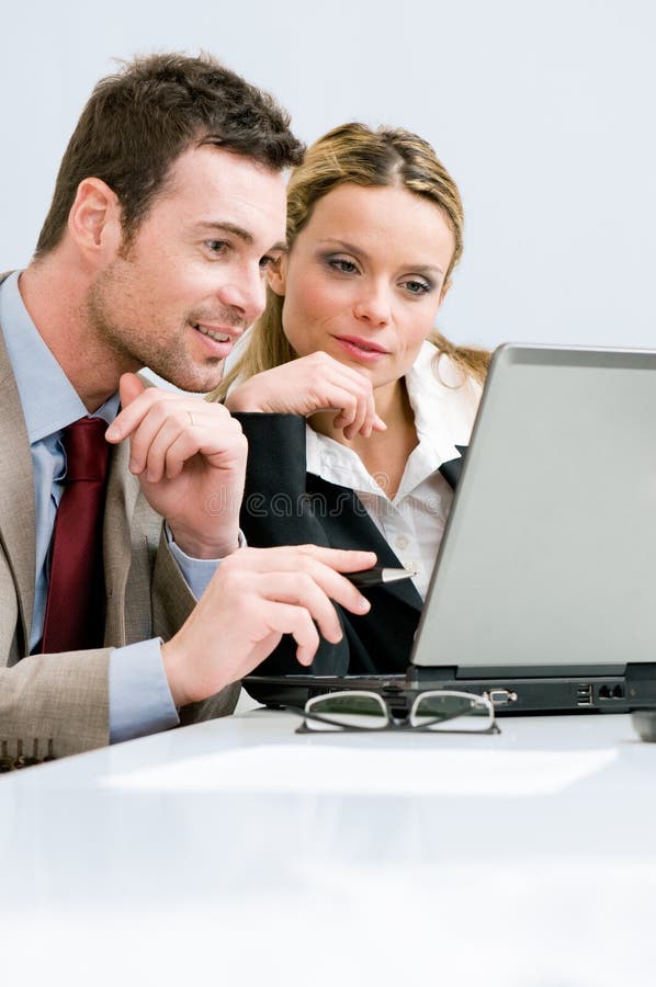 Working together on laptop stock photo