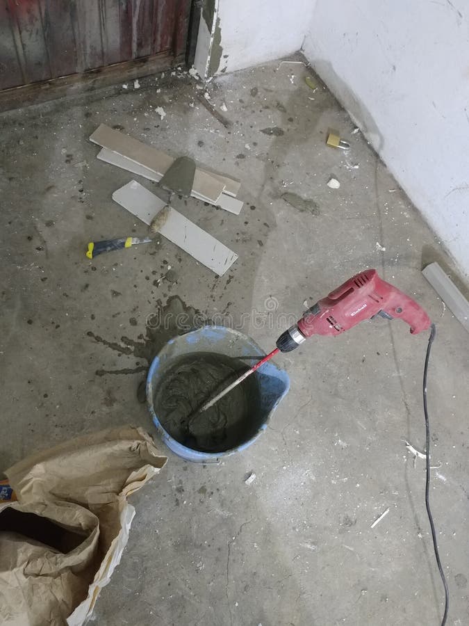 Mixing glue or cement stock photo. Image of concrete - 25002892