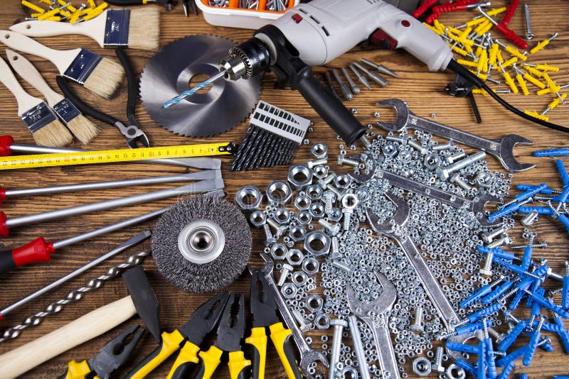 Working tools on wooden background stock image Working tools on wooden background stock image