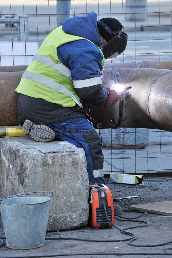 Working Welder Welds Water Pipes Stock Photo Image of construction, water 178610312