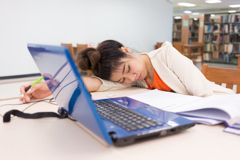 Working woman sleeping on a table royalty free stock photo Working woman sleeping on a table royalty free stock photo