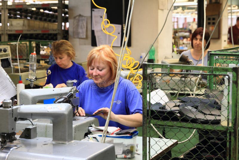 Women working at the shoes factory stock photo Women working at the shoes factory stock photo