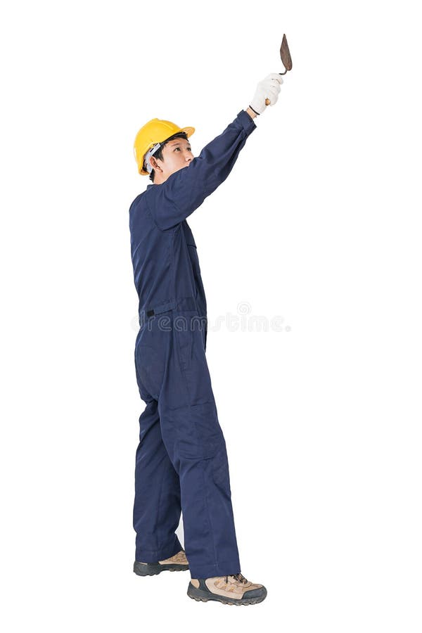 Workman with blue coveralls and hardhat in a uniform holding ste