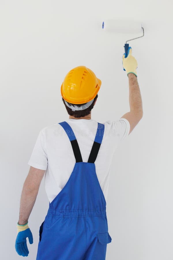 Workman painting wall stock image. Image of wall, labor 59323805