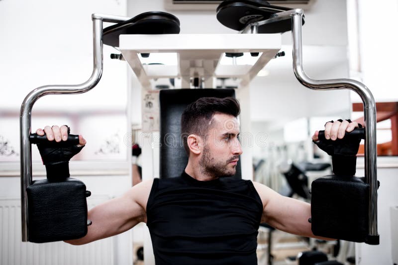 Handsome Man Working Out at Gym, daily Chest Exercise Routine Stock