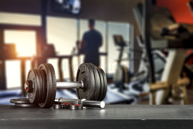 Workout in the Gym. Dumbbells on Black Table Top. Copy Space with Blurred  Gym Background. Stock Photo - Image of equipment, black: 161444120