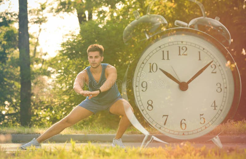 Workout time. Double exposure of man doing exercise on sunny morning in park and alarm clock, color toned