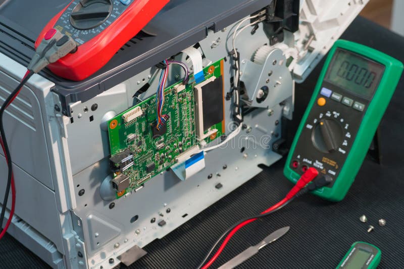 Workplace engineer to repair laser printers. stock images Workplace engineer to repair laser printers. stock images