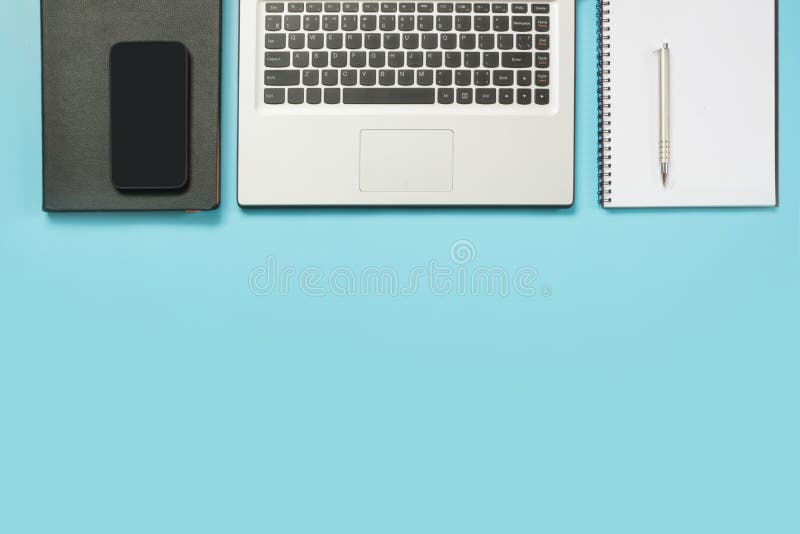 Workplace with open laptop and accessory on office blue table. Top view and copy space. stock photos Workplace with open laptop and accessory on office blue table. Top view and copy space. stock photos