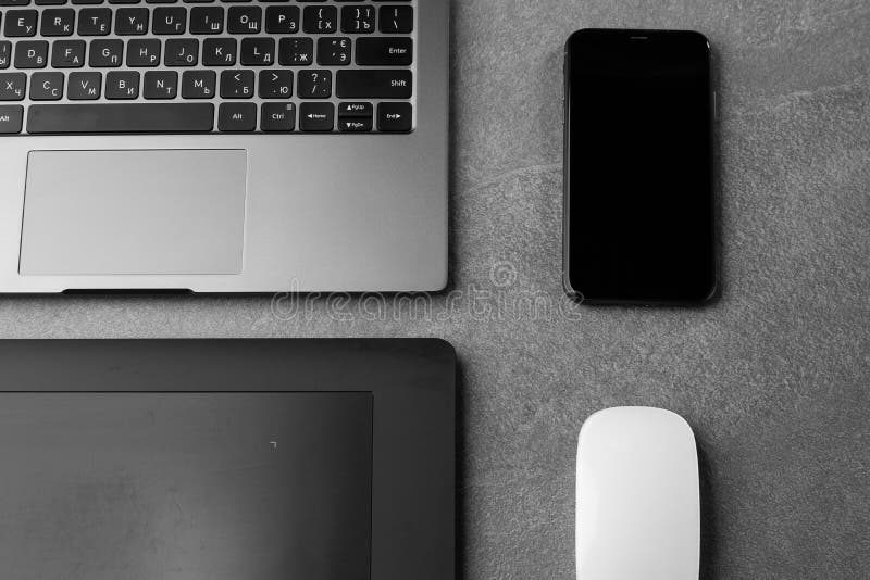 Workplace with Open Laptop with Black Screen and Mouse on Modern Grey Stone Desk, Filtered Image