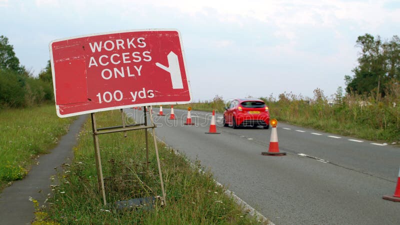 Works Access only Sign Next To Roadworks Cones Flashing on UK Motorway