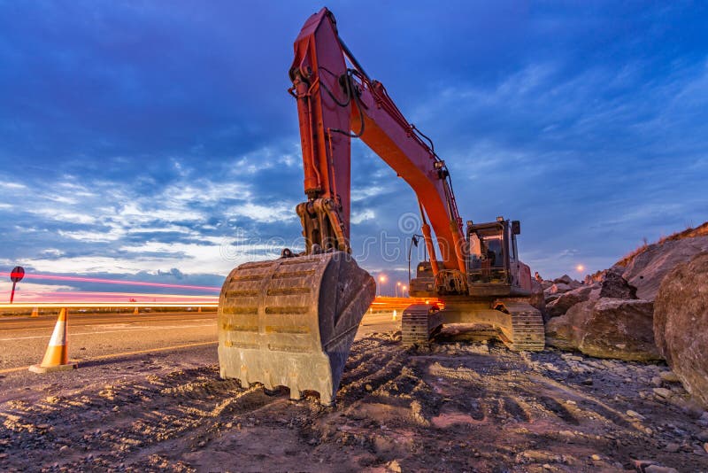 Works of Extension of a Road with Excavator and Delimited by Safety ...