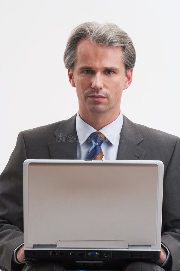 Portrait of a handsome businessman with his laptop. Portrait of a handsome businessman with his laptop