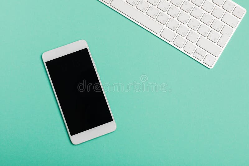 Workspace with keyboard and smartphone space on Blue color background. Top view. Flat lay style. Concept clean layout stock images, royalty-free photos and pictures