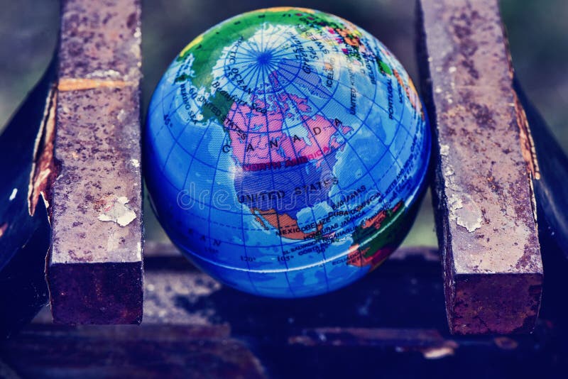 World globe in a vise stock images World globe in a vise stock images