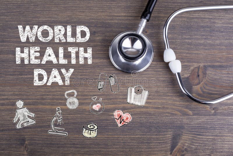 World health day. Workplace of a doctor. Stethoscope on wooden desk background royalty free stock images World health day. Workplace of a doctor. Stethoscope on wooden desk background royalty free stock images