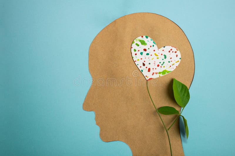 World Heart and Mental Health Day. Paper Cut as Human Head with Leaf Tree and Colorful Heart Shape Flower inside the Brain. Psychology, Creativity and Positive Mind Concept