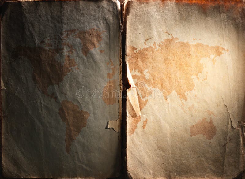 World map displayed on the spread of vintage books stock photos