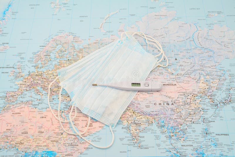 World map and face mask thermometer. Bacteria, be, safe, biohazard, business, cold, conspiracy, contagion, continent, coronavirus, country, covid19, dangerous stock photography World map and face mask thermometer. Bacteria, be, safe, biohazard, business, cold, conspiracy, contagion, continent, coronavirus, country, covid19, dangerous stock photography