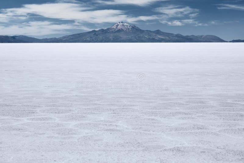 The world s largest salt flat and dormant volcano Tunupa at the far background