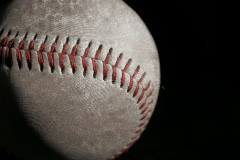 Worn baseball ball on black background, closeup. Space for text royalty free stock image