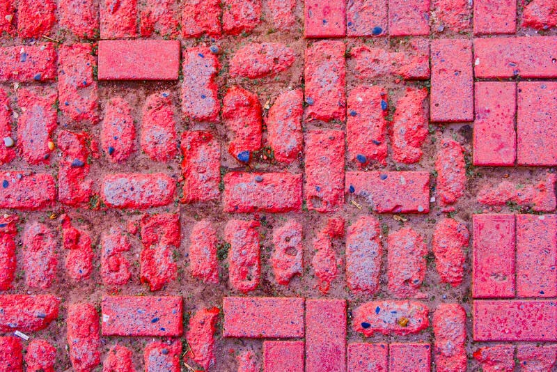 Worn footpath walk textured in red brick blocks floor above view. Red rectangle shape clay tile floor pattern. Clay brick pavement royalty free stock photo