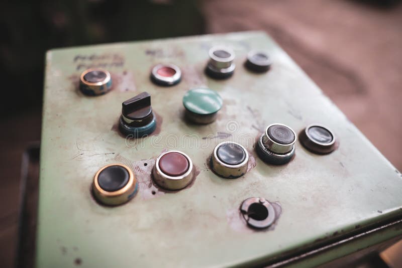 Worn out machinery control panel in a dirty and old but still functioning metal works, old fashioned, factory stock photography Worn out machinery control panel in a dirty and old but still functioning metal works, old fashioned, factory stock photography