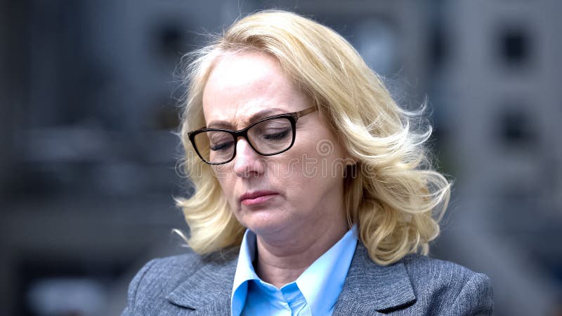 Worried elderly business lady feeling sad of work troubles, dismissal stress stock images Worried elderly business lady feeling sad of work troubles, dismissal stress stock images