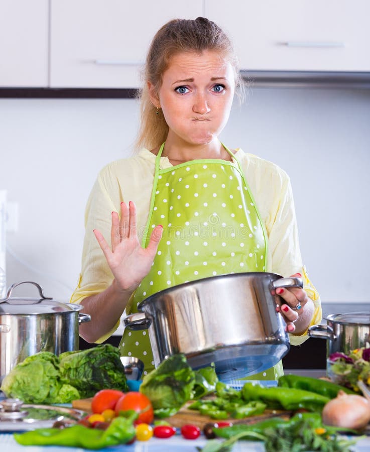 Worried Housewife with Spoiled Food Stoc