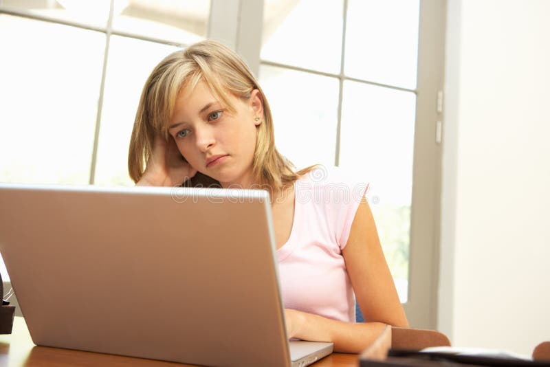 Download Worried Looking Teenage Girl Using Laptop At Home Stock Image - Image of quarter, home: 15084847