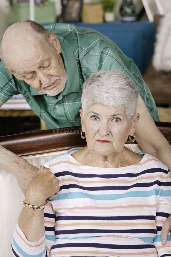 Worried Senior Man and Woman Embracing royalty free stock images Worried Senior Man and Woman Embracing royalty free stock images