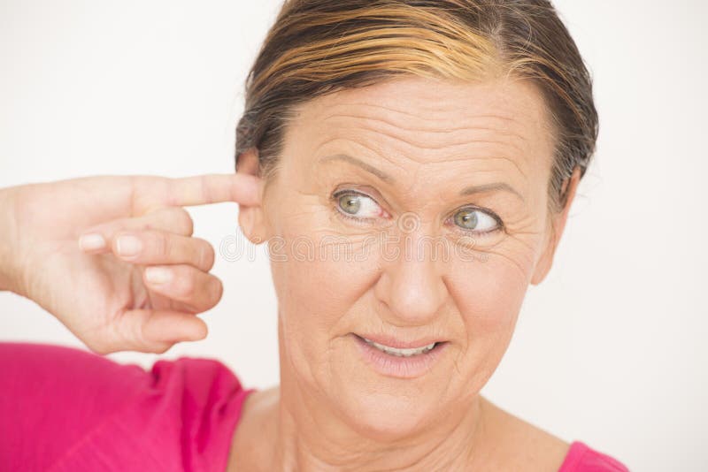 Worried stressed woman finger in ear. 