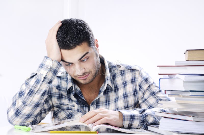 Worried student looking books on white background stock images