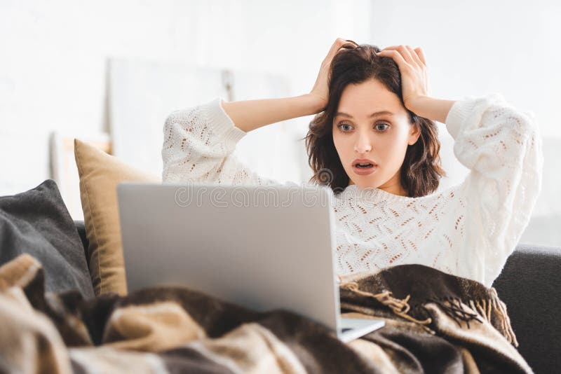 Young Woman in Blanket Using Laptop on Sofa Stock Image Image of young, connection 199168989