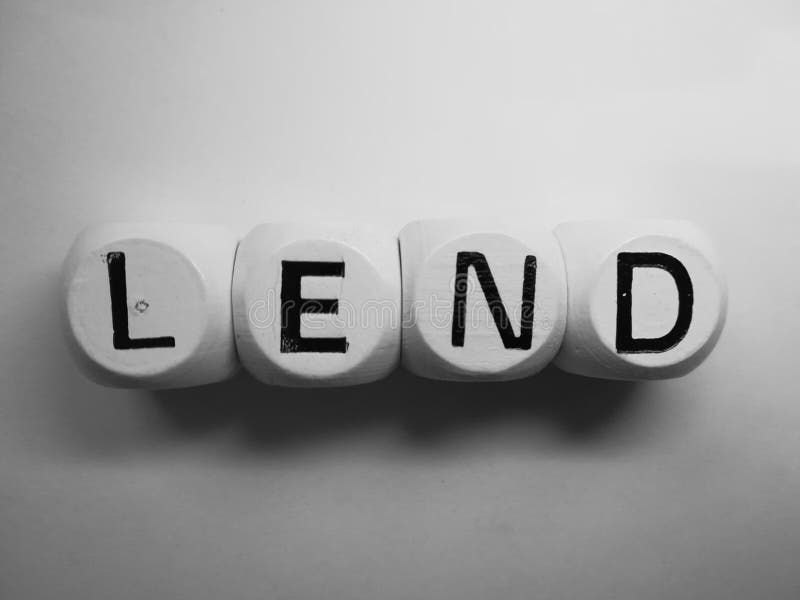 Wort leihen buchstabiert auf Würfeln lizenzfreies stockbild Wort leihen buchstabiert auf Würfeln lizenzfreies stockbild