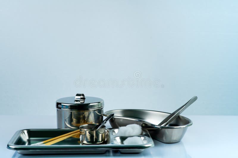 Wound care dressing set and stainless steel plate, forceps, cotton balls, iodine cup, conform bandage, instruments container. royalty free stock photos Wound care dressing set and stainless steel plate, forceps, cotton balls, iodine cup, conform bandage, instruments container. royalty free stock photos
