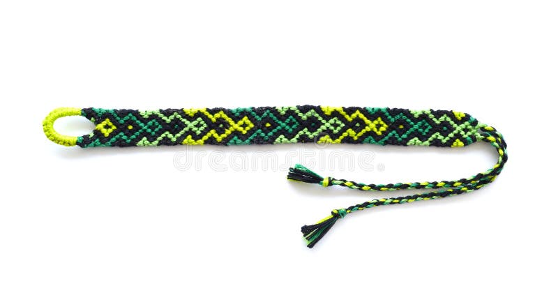 Woven DIY friendship bracelet handmade of embroidery bright thread with knots on white background.