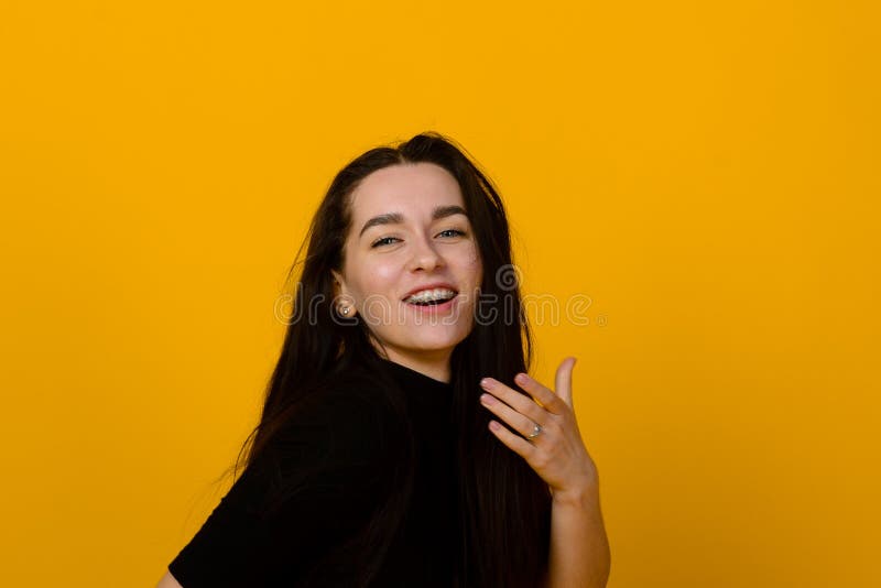 Wow. Beautiful Female Front Portrait Isolated on Yellow Studio ...