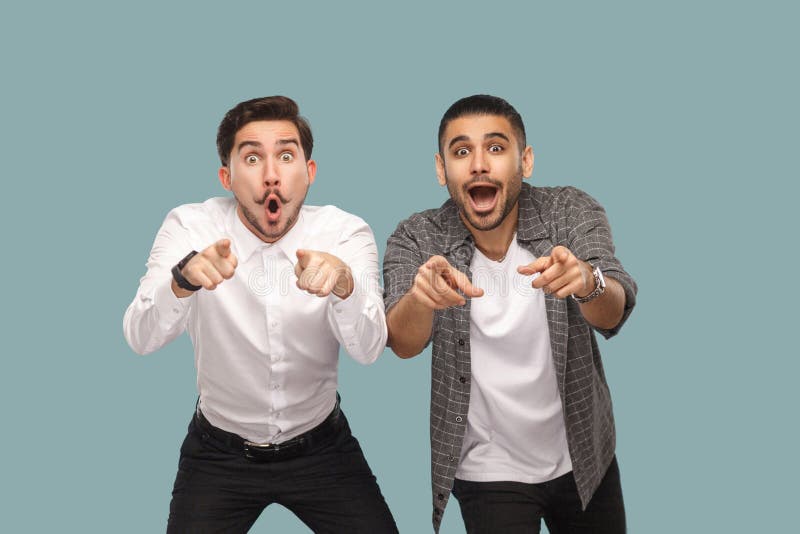 wow, are you serious? two surprised pointing finger handsome bearded friends standing and looking at camera with open mouth and b royalty free stock image wow, are you serious? two surprised pointing finger handsome bearded friends standing and looking at camera with open mouth and b royalty free stock image