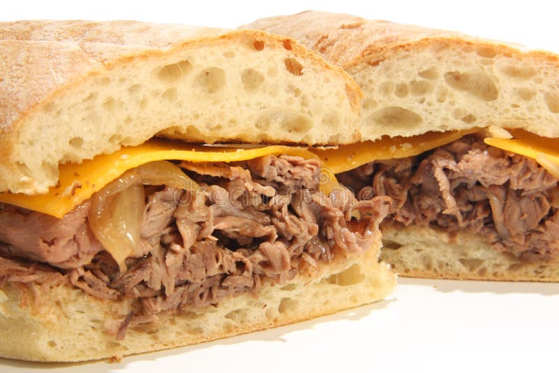 Beef dip sandwich with cheese and au jus. Beef dip sandwich with cheese and au jus.