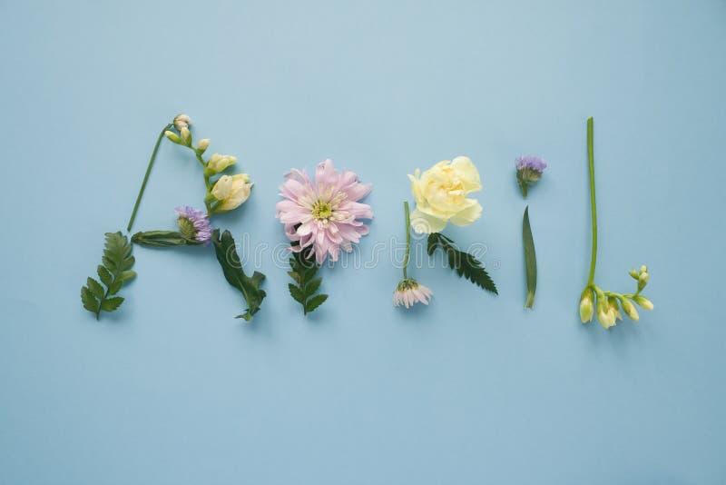 Wpisowy Kwiecień, wykładający z różnymi kwiatami