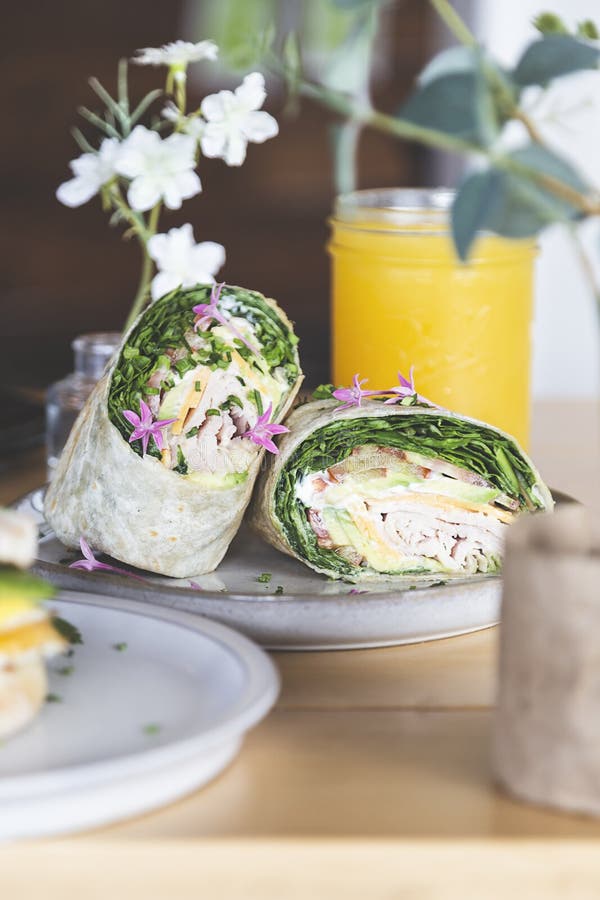 Wrap with Lettuce, Tomato, Ham and Cheese on the Table of a Fancy