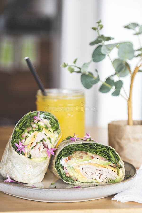 Wrap with Lettuce, Tomato, Ham and Cheese on the Table of a Fancy