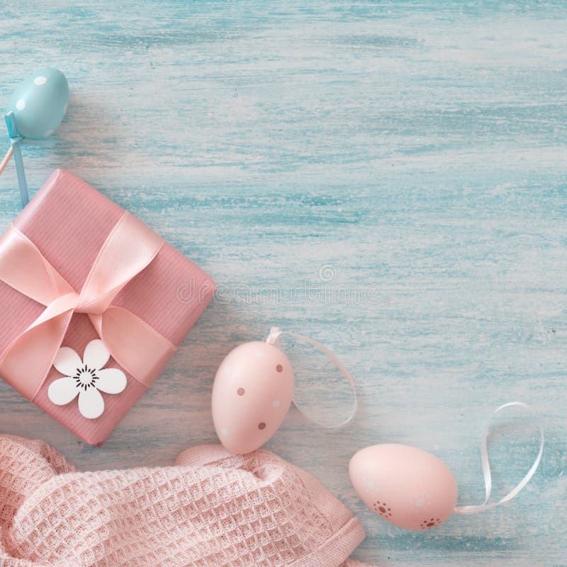 Wrapped Gift Box, Decorative Flowers and Easter Eggs. Easter Flat Lay