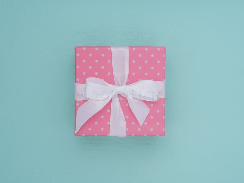 Wrapped vintage gift box. Copy space. Pastel Colour flat lay minimal concept. Pink rose. stock photos