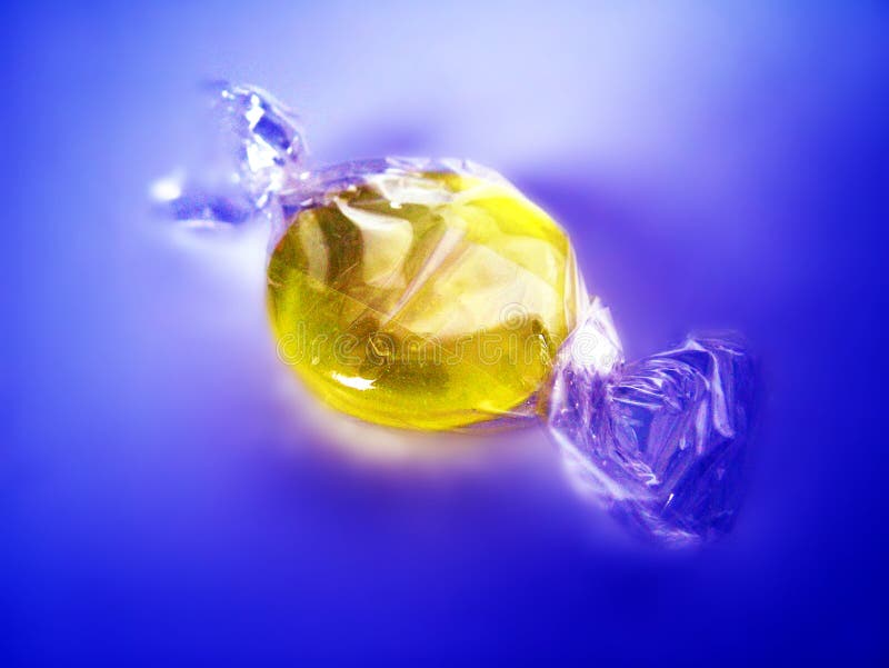 Wrapped yellow candy stock photo. Image of treat, candy 7182754