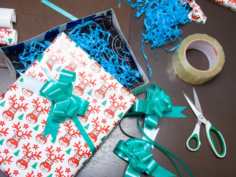 Wrapping Paper, Scissors, Tape And Ribbon With Christmas Tree Stock Photo,  Picture and Royalty Free Image. Image 32625021.