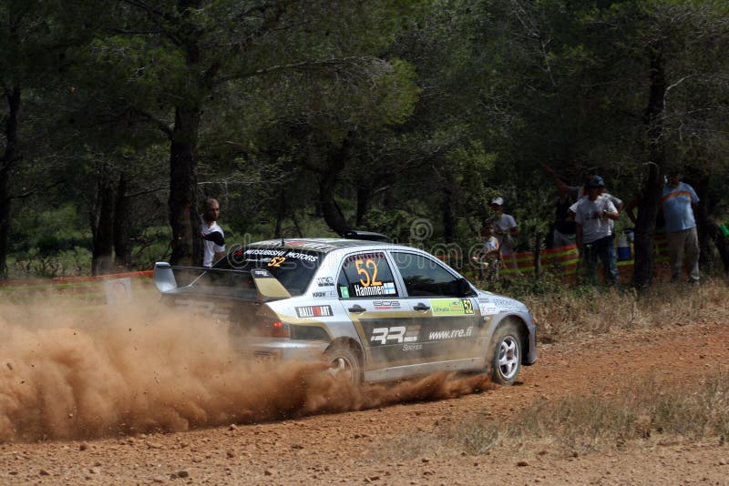 A trail of dust left behind by the race car at the WRC 55th Acropolis Rally 2008 in Greece. A trail of dust left behind by the race car at the WRC 55th Acropolis Rally 2008 in Greece.