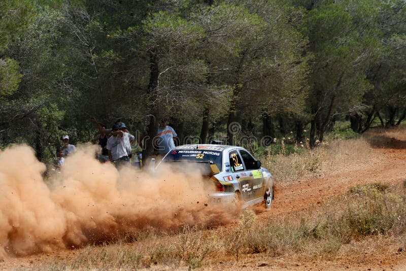 A trail of dust left behind by the race car at the WRC 55th Acropolis Rally 2008 in Greece. A trail of dust left behind by the race car at the WRC 55th Acropolis Rally 2008 in Greece.